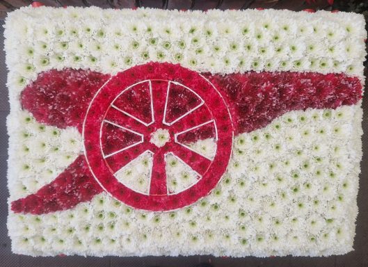 An Arsenal floral tribute showing the "Gunners" logo.
